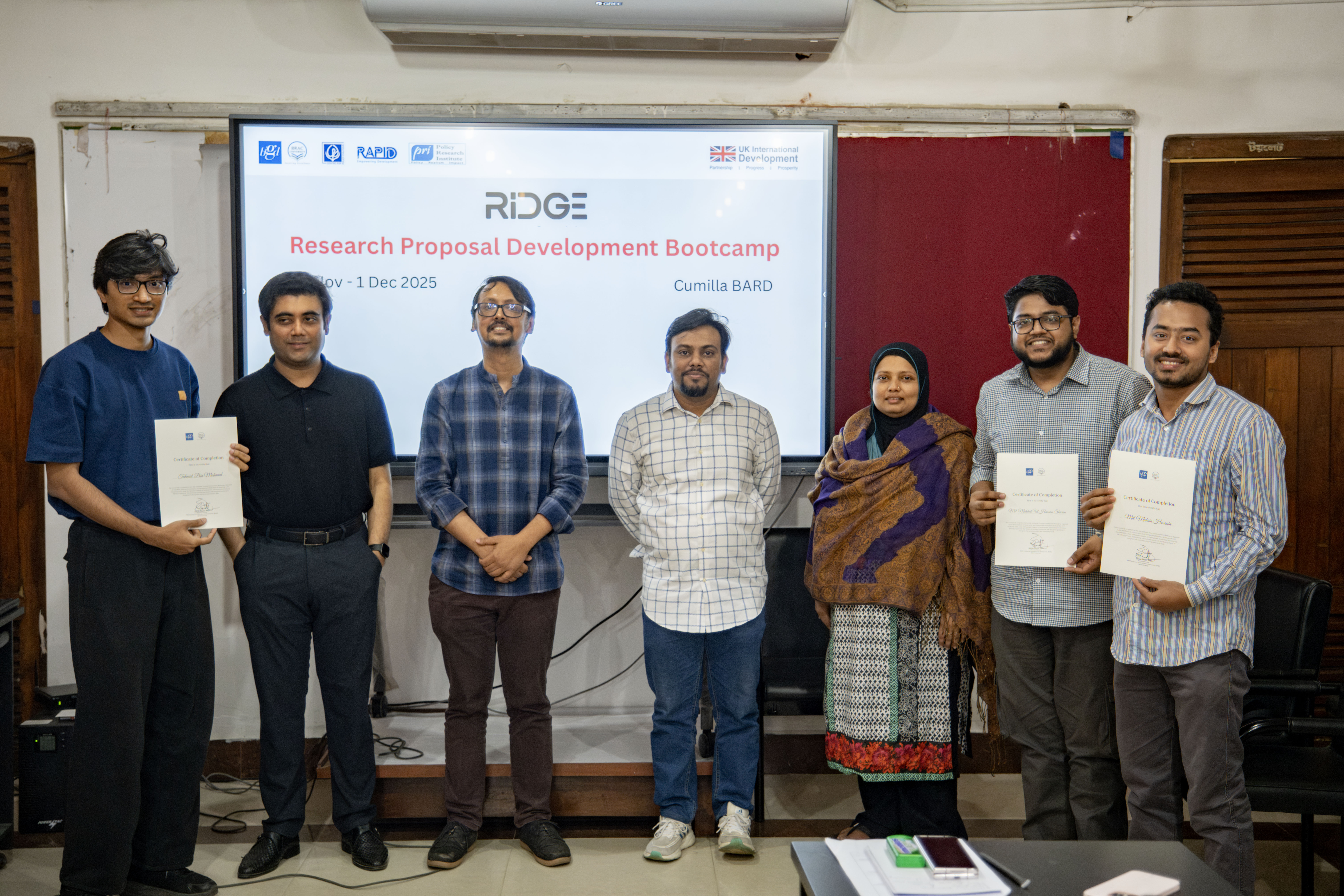 RIDGE bootcamp participants with certificates after presentations.